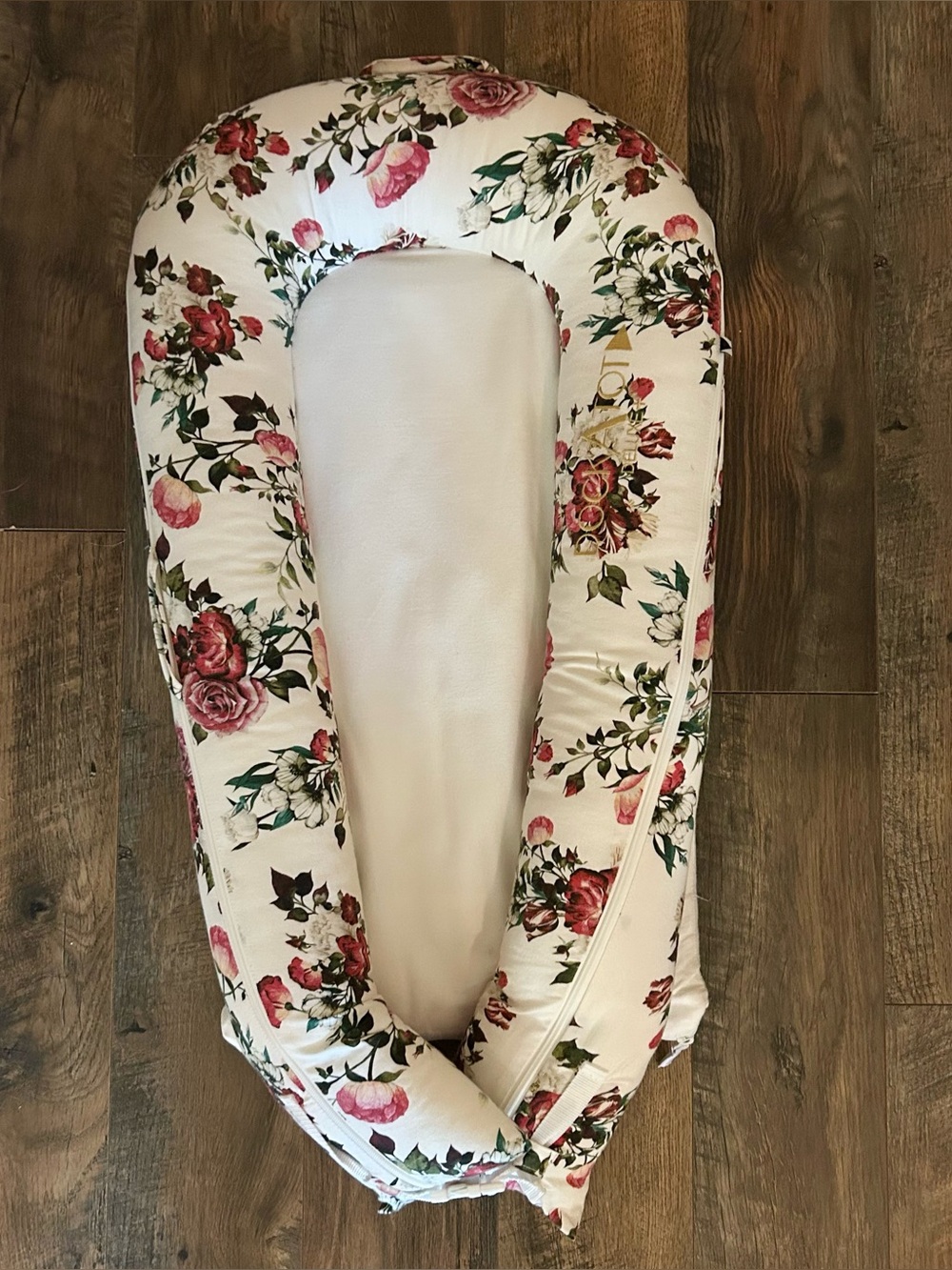 DockATot Deluxe+ Dock in the "La Vie en Rose" floral print